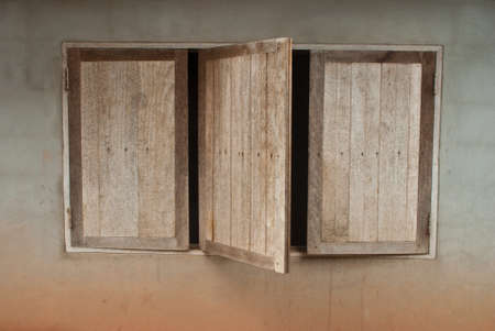 wooden windows on concrete wallの写真素材