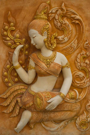 angel relief in terracotta in thailandの写真素材