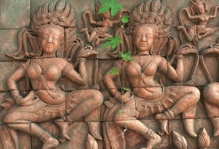 Apsara earthenware with green leaf ,thailandの写真素材