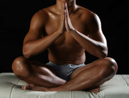 Sit in a comfortable position, doing meditation.の写真素材