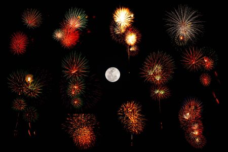 Set of colorful fireworks and full moom isolated on black backgroundの写真素材