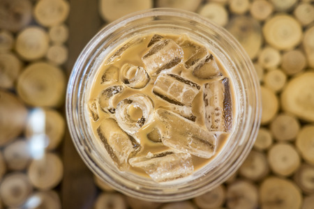Iced coffee in take away plastic glass, closeup, top viewの写真素材
