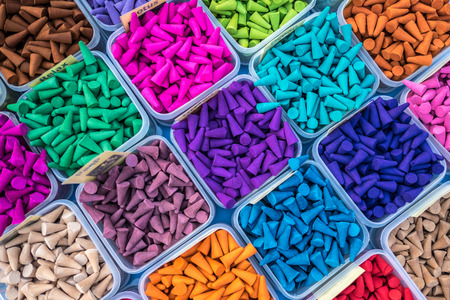 Colorful frankincense cones or gum benjamin in plastic containersの写真素材