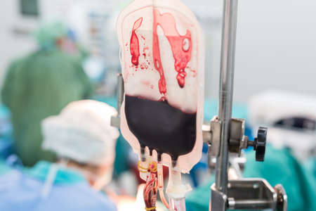 giving packed red cell blood during surgeryの写真素材