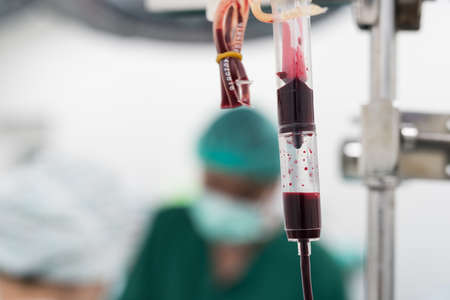 giving packed red cell blood during surgeryの写真素材