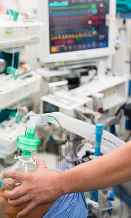anesthesiologist doctor hold oxygen mask