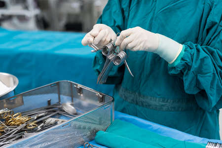 scrub nurse prepare medical equipments for surgeryの写真素材
