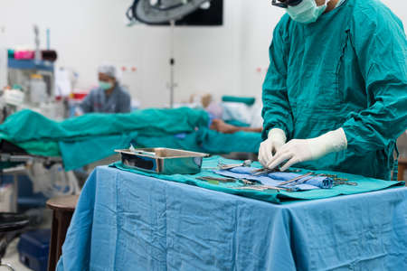 scrub nurse prepare medical equipments for surgeryの写真素材