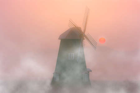 The beauty of the mist and wind turbines in the morning