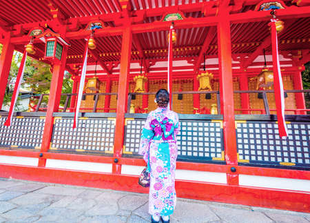 Woman wear yukata or kimino pray at Imado Shrineの写真素材