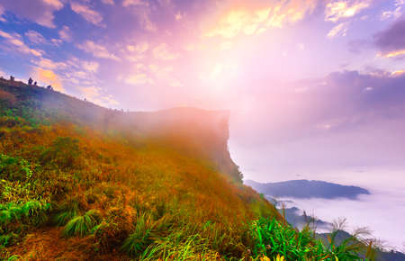 Sunrise scene with the peak of mountain with morning fog at Chiangrai,Thailandの写真素材