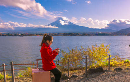 Tourist Girl and Mt. Fuji , Traveler woman take a photo at Fuji mountainsの写真素材