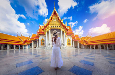 Asian woman tourist visit the beauty of Wat Benchamabophit,Bangkok thailandの写真素材
