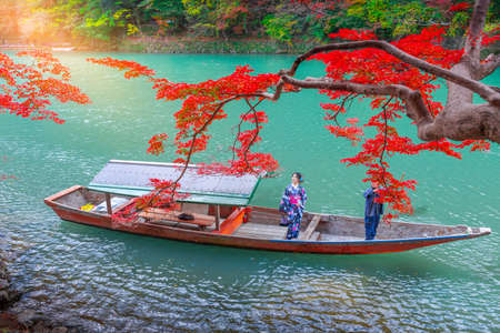Travelers wear a kimono to see the beauty of autumnの写真素材