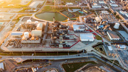 Aerial top view Electrical power plant, support oil refinery and gas refinery plant form industry zoneの写真素材