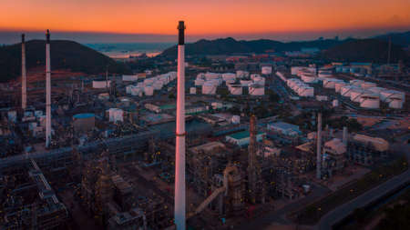 Aerial view oil and gas industrial, Refinery factory oil storage tank and pipeline steel at twilightの写真素材