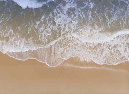 Aerial shot of the couple on the white sand beach in Thailand