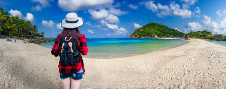 Summer lifestyle image. Happy asian woman travels in Thailand. Enjoying at the stunning turquoise sea view at Kho nang yuan island,Surat thani,Thailandの写真素材