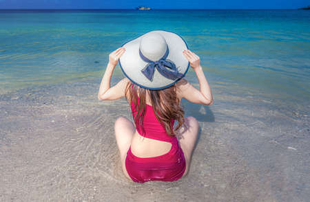 Asian woman in swimsuit relaxing on the beach at Koh nang yuan island,Thailandの写真素材