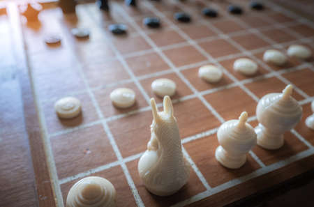 Makruk or Thai chess board game consists of 2 side. Each side consists of 1 King (Khun), 1 queen (Met), 2 Bishops (Khon), 2 Horses (Ma), 2 Rook (Ruea) and 8 Pawns (Bia)の写真素材