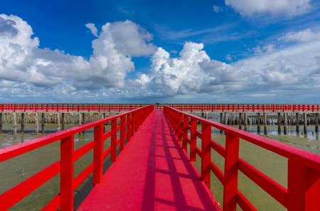 The red bridge and cloudy blue sky background. bridge cross the sea. Samutsakhon province Thailandの写真素材