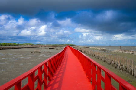 The red bridge and cloudy blue sky background. bridge cross the sea, Samutsakhon province,Thailandの写真素材