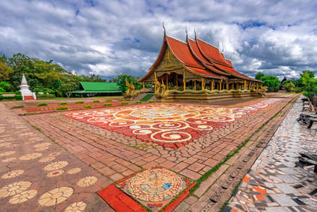 Marvel at the color and beauty of Sirindhorn Wararam Phu Prao Temple during the day, Ubon Ratchathani Province, Thailandの写真素材