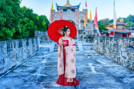 Asian woman wearing a red Chinese culture dress visit Santichon Village, Pai, Mae Hong Son province, Thailandの写真素材
