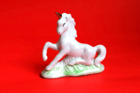 Red Ceramic Horse on red Backgroundの写真素材