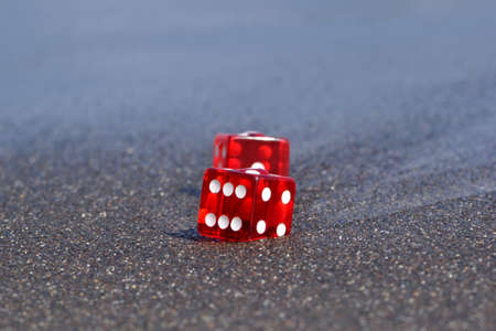dices on sandの写真素材