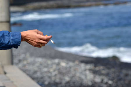  Woman hand with cigaretteの写真素材