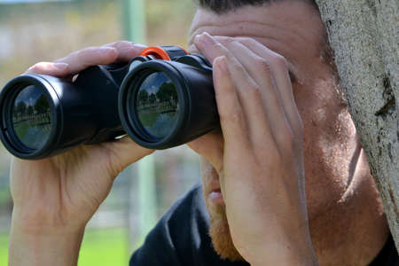 Man looking for a prismaticの写真素材