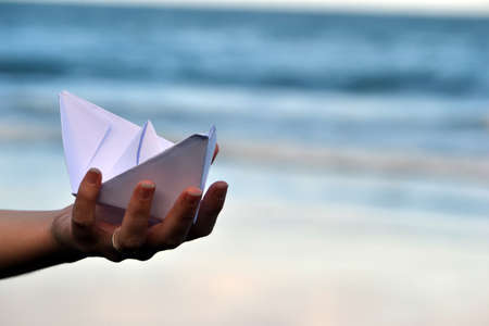 Paper boat on beachの写真素材