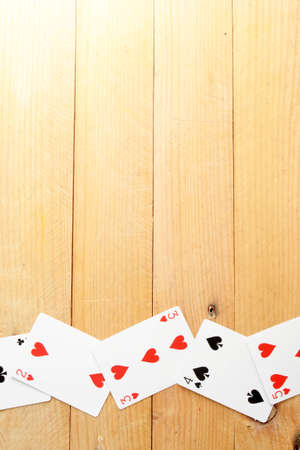 Poker cards on woodの写真素材