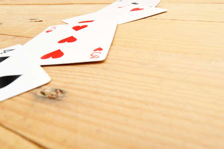 Poker cards on woodの写真素材