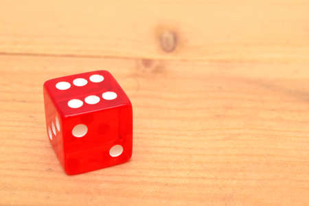 Red dice on woodの写真素材