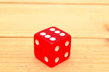 Red dice on woodの写真素材