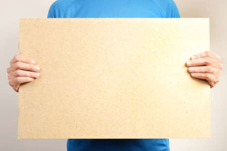 Man with a bulletin board in handの写真素材