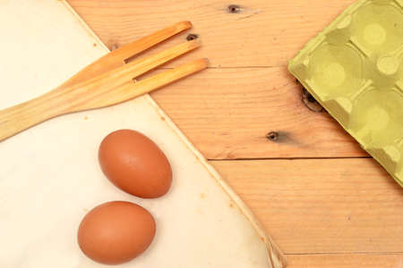 Hat cooking, eggs, wooden fork and salt