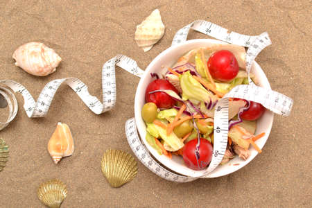 Salad and tape measureの写真素材