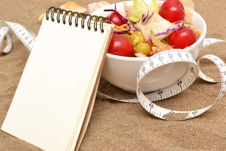 Salad and tape measureの写真素材