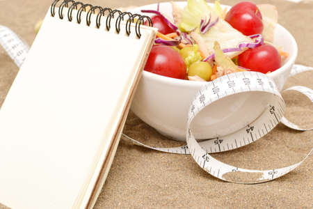 Salad and tape measureの写真素材