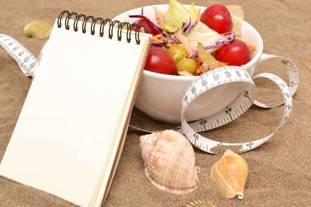 Salad and tape measureの写真素材