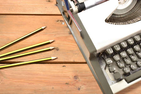 Typewriter and pencilsの写真素材