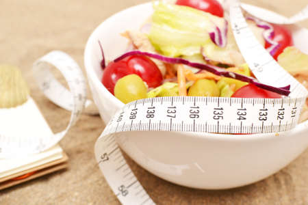 Salad and tape measureの写真素材