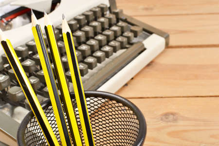 Typewriter and pencilsの写真素材