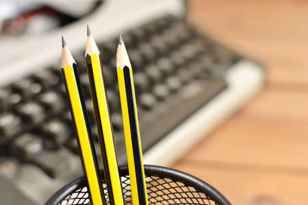 Typewriter and pencilsの写真素材