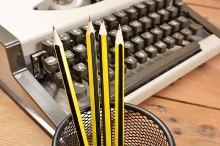 Typewriter and pencilsの写真素材