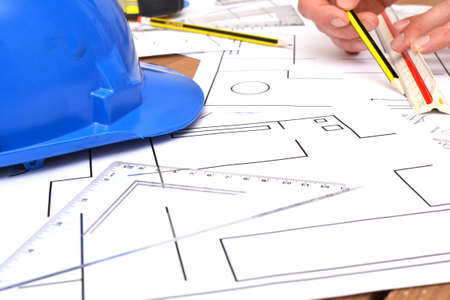 Architect working with blueprintsの写真素材