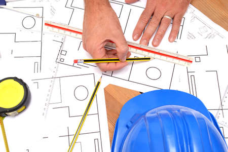 Architect working with blueprintsの写真素材